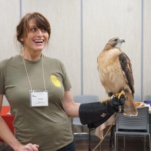 Debbie Sykes with a red-tailed hawk